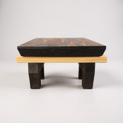 Bonsai stand with a medium brown warm top and light base on a white background